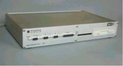 Kongsberg electronic scoring system control unit with front panel switches and data slots.