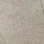 An image of brown filler board panel with indentations showing where the panel divides running diagonal near each corner.