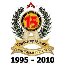 Spartan Tactical 15th anniversary logo, with laurel wreath, ribbon, and text “Celebrating 15 years of excellence in training, 1995–2010.