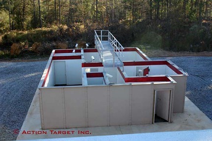 Structure with rooms and walkways; outdoors on gravel with trees surrounding. Text: "© Action Target Inc."