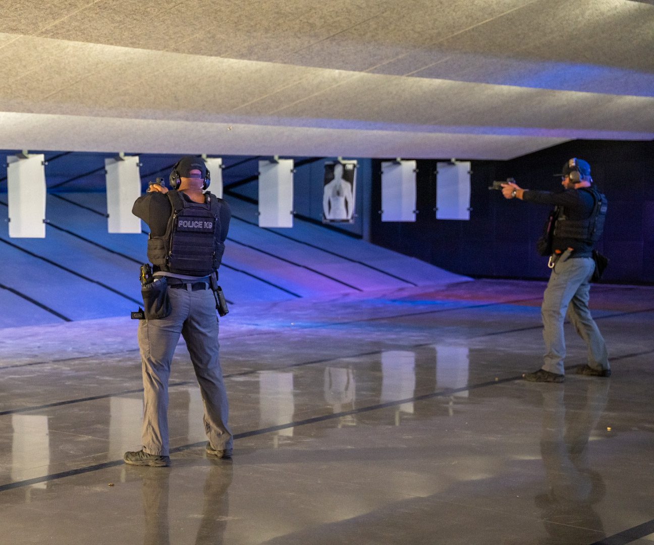Two officers training downrange shooting at various angels