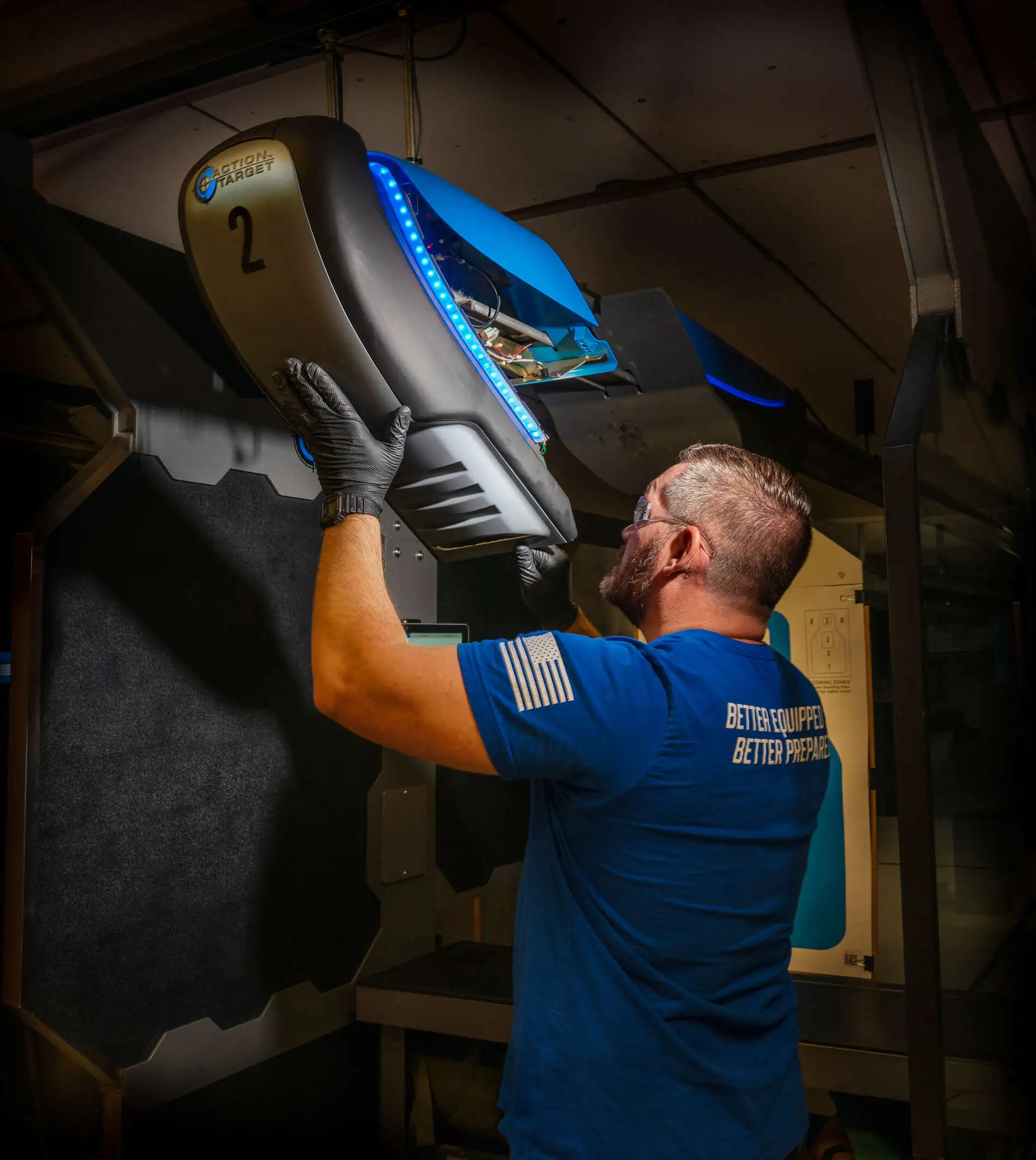 Range services technician fixing Action Target genesis target retriever.