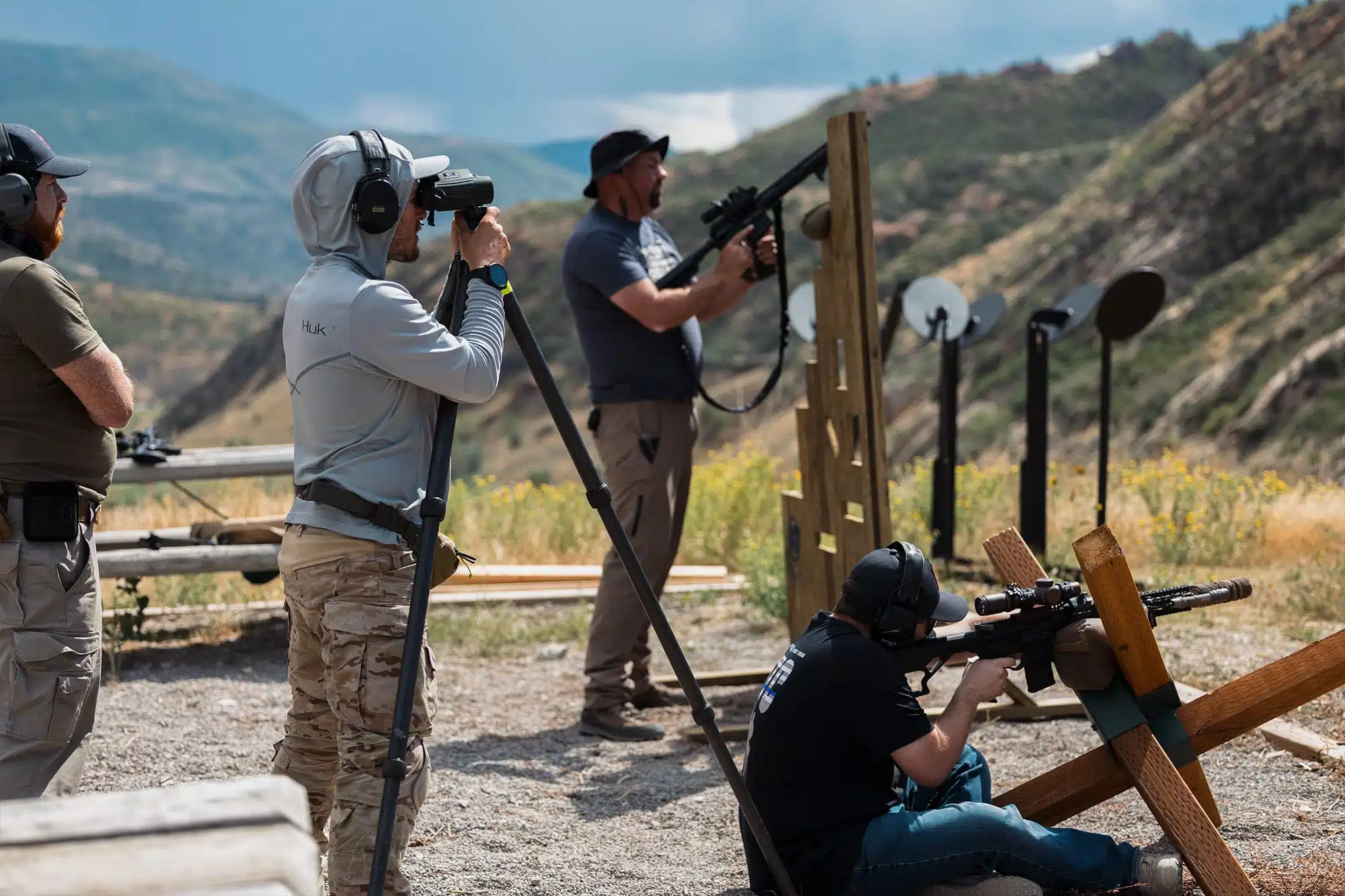 Three police officers preparing to shoot their rifles at LETC