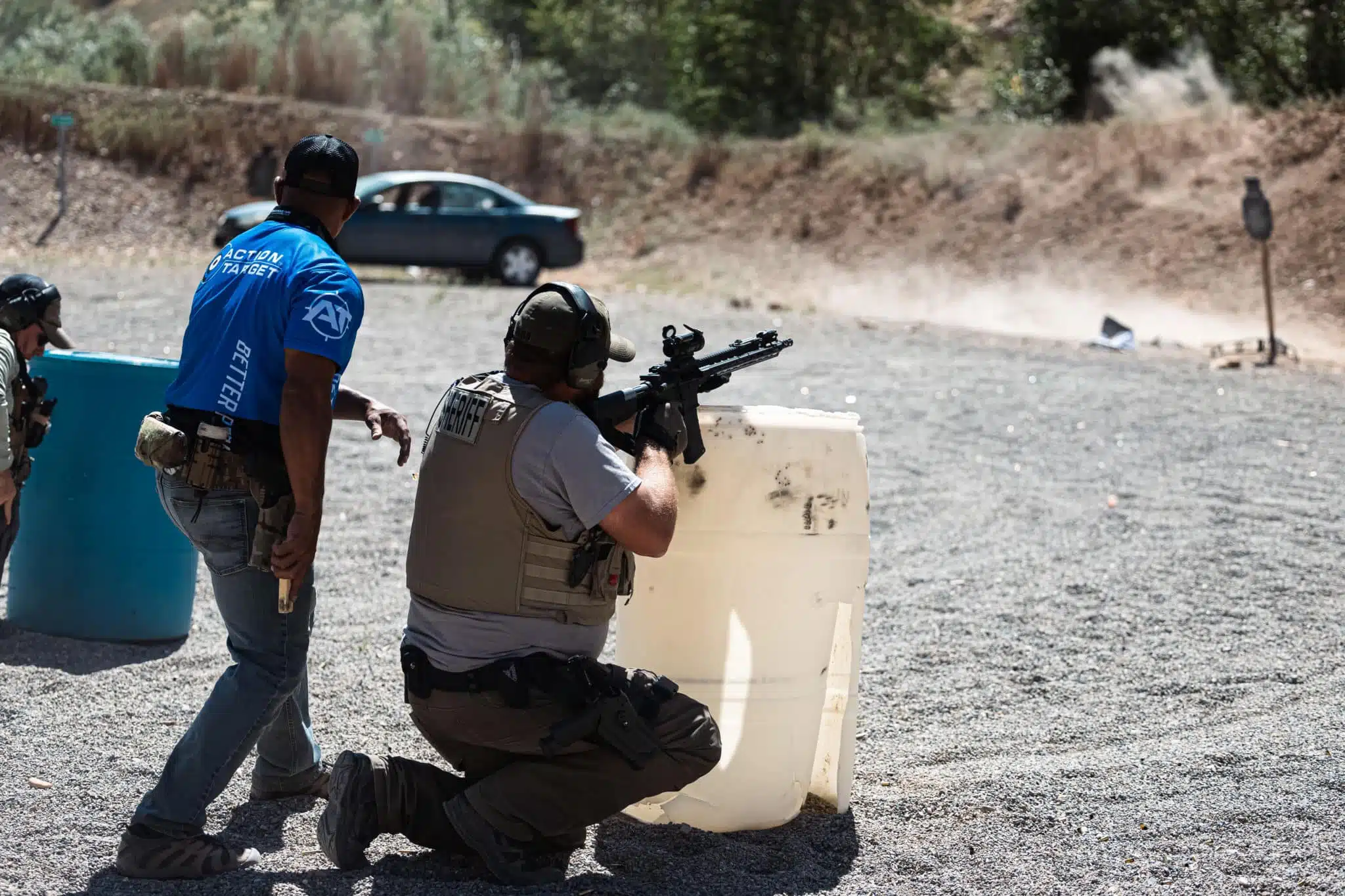 Police officer training with his rifle at LETC with an instructor standing next to him