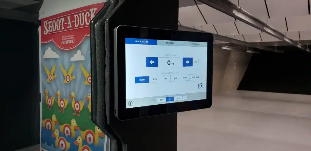 Touchscreen panel controls target distance at a shooting range, near