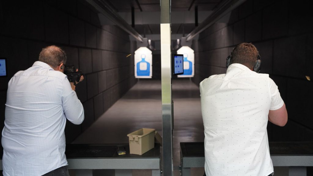Action Target employees using an Action Target home shooting range