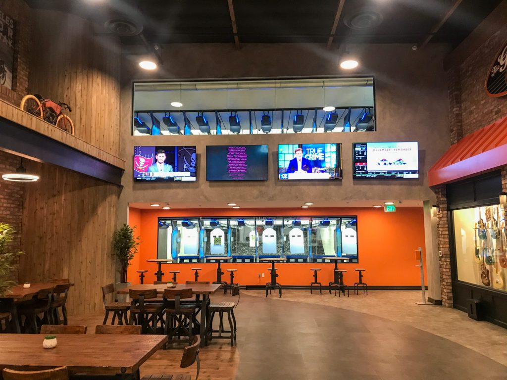 Lobby of a commercial shooting range with two bays visible