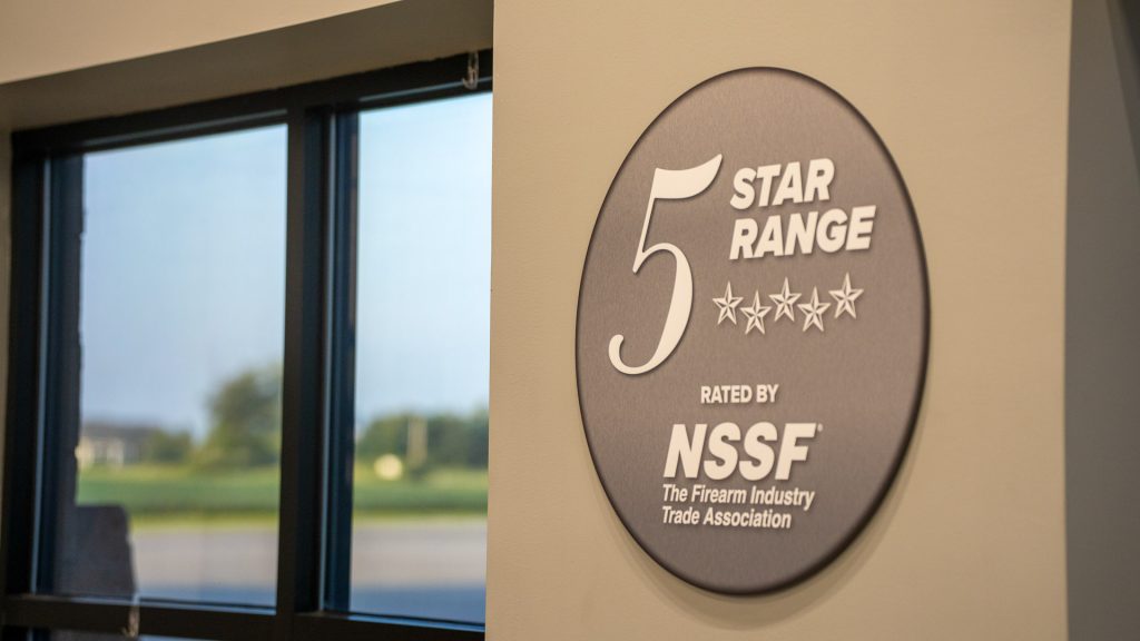 A sign given to Lake Erie Arms awarding it a 5-Star Range from NSSF