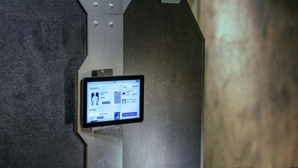 A SmartRange AXIS tablet with POS system displayed. Targets are added to cart.